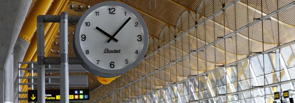 Why is it essential to display an accurate time in an airport?